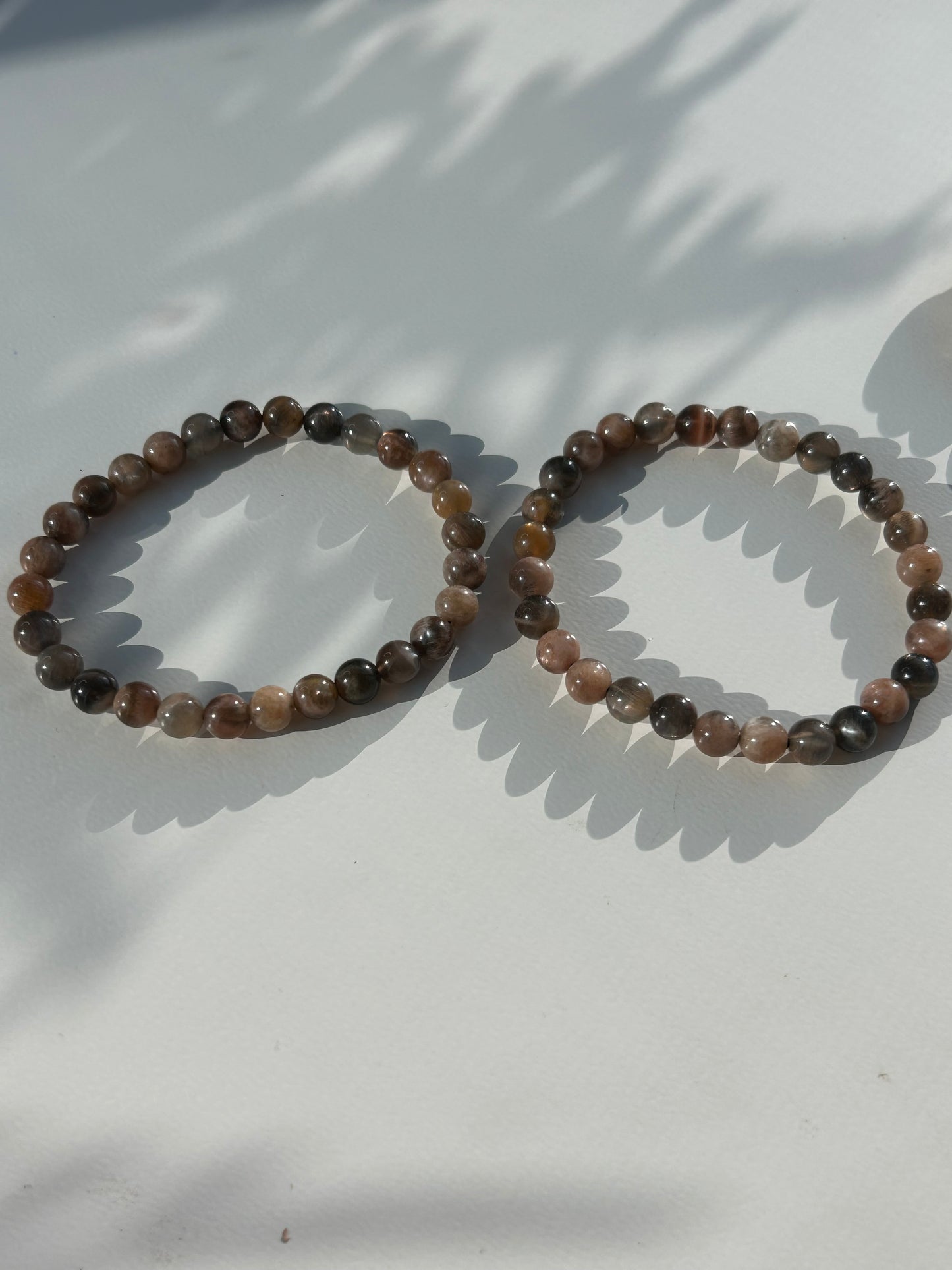 Black moon and sunstone beaded bracelet