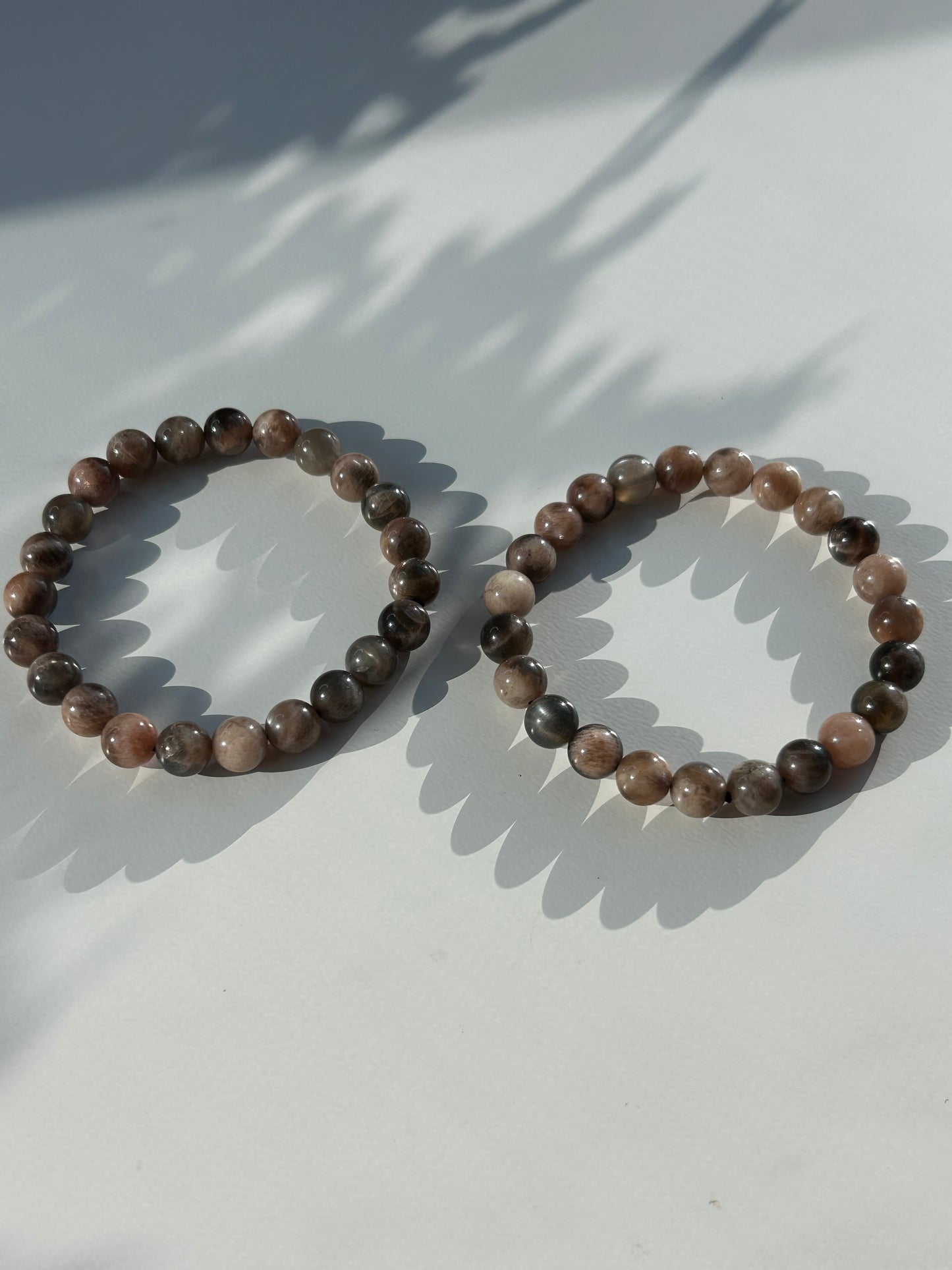 Black moon and sunstone beaded bracelet