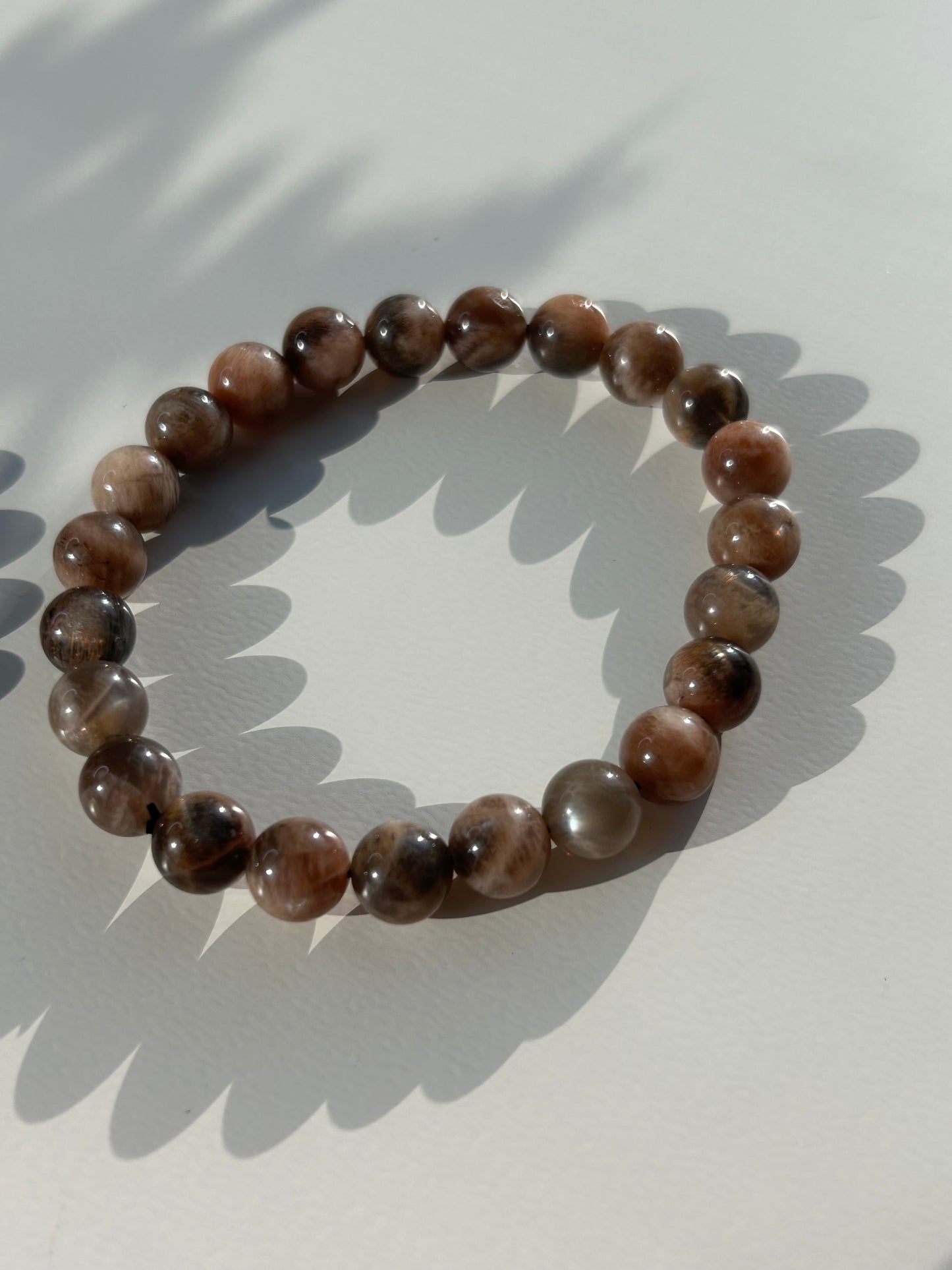 Black moon and sunstone beaded bracelet