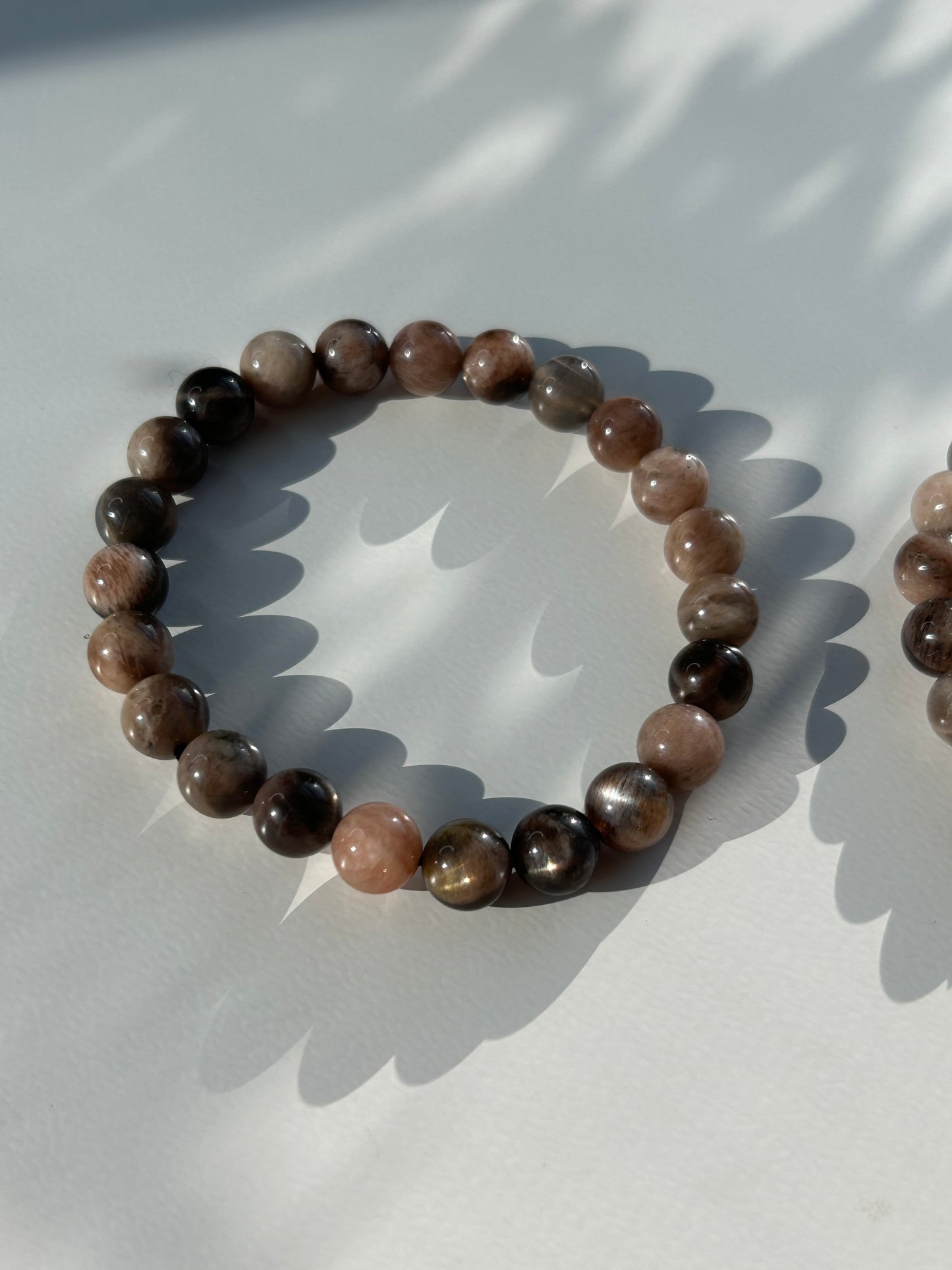 Black moon and sunstone beaded bracelet