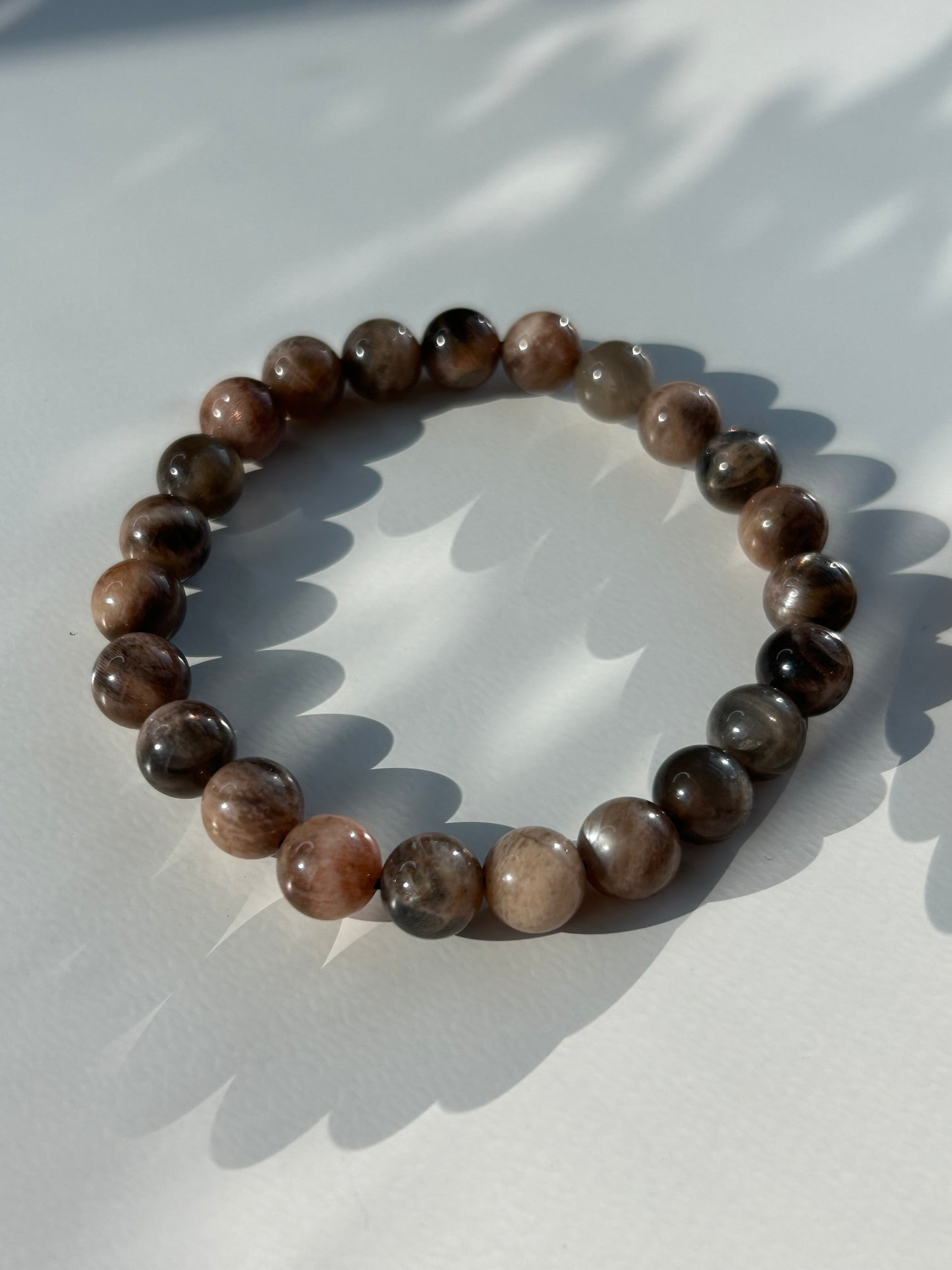 Black moon and sunstone beaded bracelet