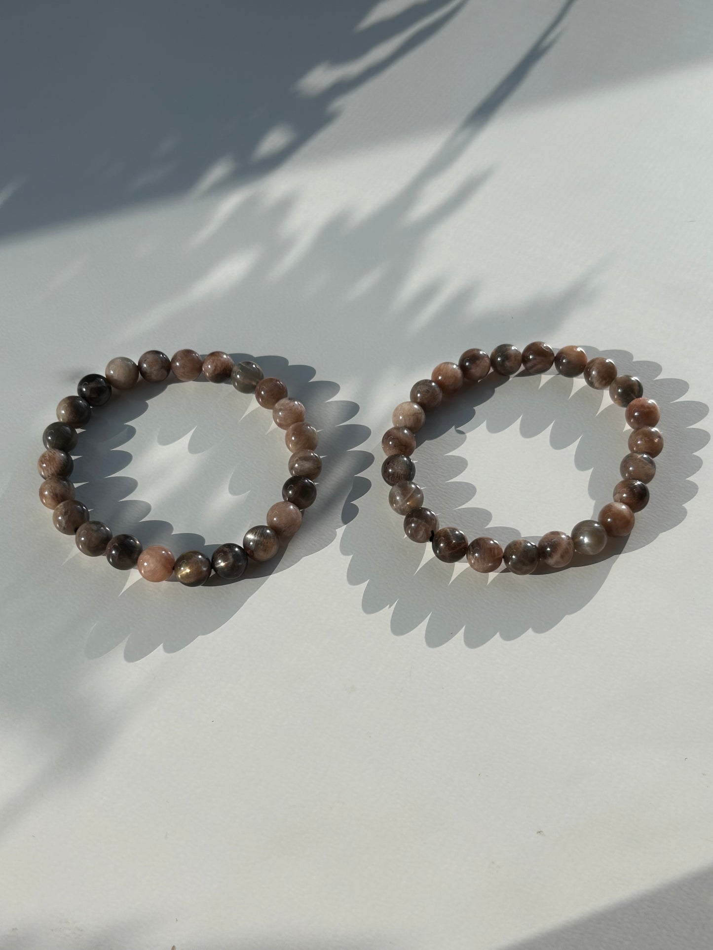 Black moon and sunstone beaded bracelet