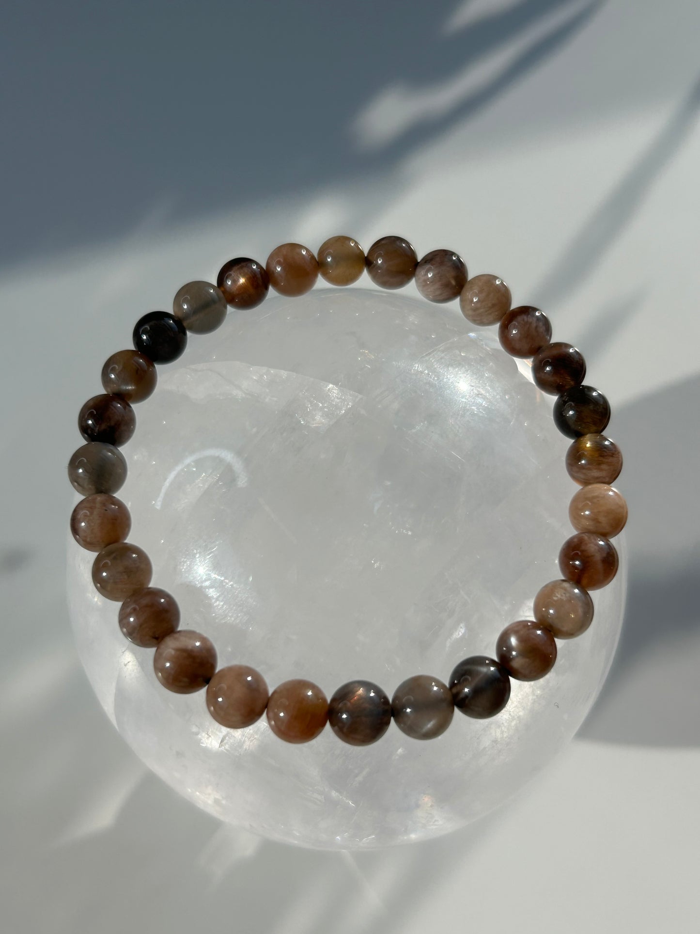 Black moon and sunstone beaded bracelet