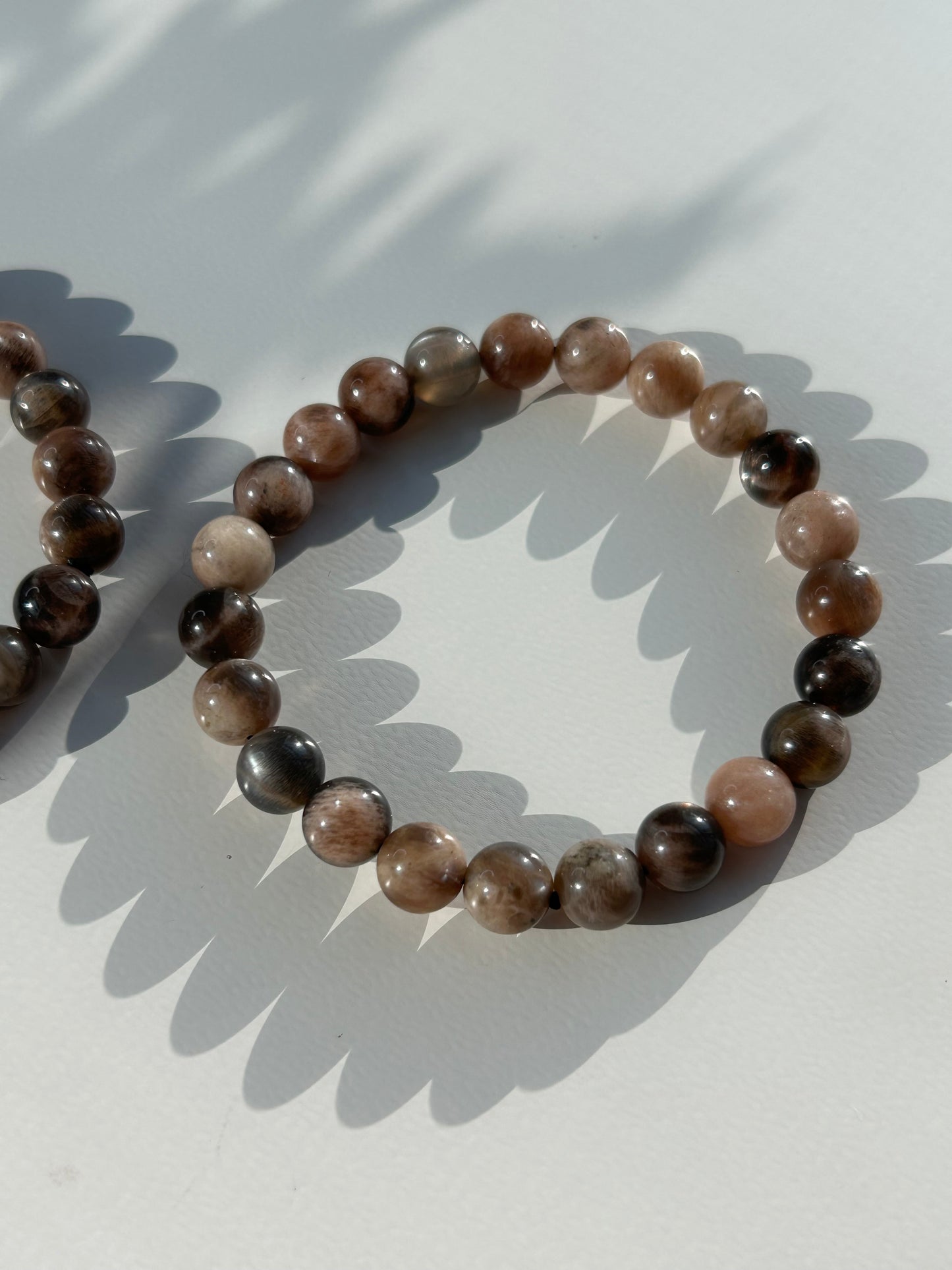 Black moon and sunstone beaded bracelet